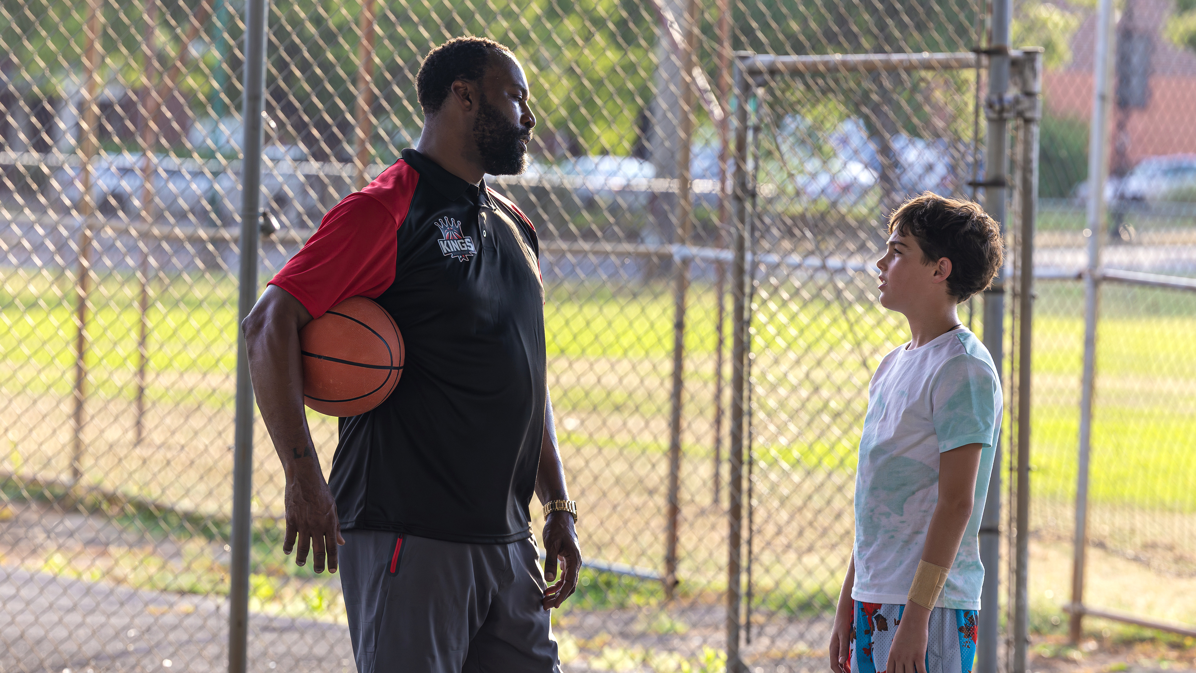 Last Shot — courtside conversation through the fence